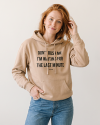Woman wearing Sandstone Don't Rush Me I'm Waiting For The Last Minute hoodie