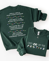 Forest green Friends-inspired Christmas crewneck sweatshirt showing Could I BE Any More Festive front lettering and Phoebe's holiday song lyrics on the back.