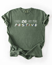 Hemp green Friends-inspired Christmas heavyweight T-shirt with Could I BE Any More Festive lettering and colorful logo-inspired dots.