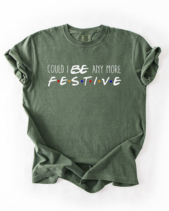 Hemp green Friends-inspired Christmas heavyweight T-shirt with Could I BE Any More Festive lettering and colorful logo-inspired dots.