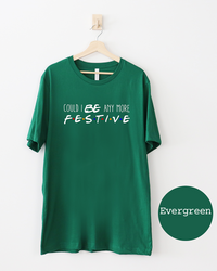 Evergreen green Friends-inspired Christmas graphic tee with Could I BE Any More Festive lettering and colorful logo-inspired dots.