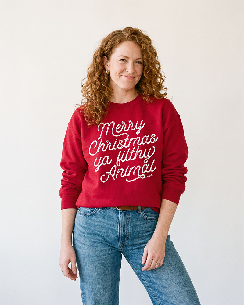 Women's cardinal Merry Christmas Ya Filthy Animal sweatshirt for Christmas movie fans