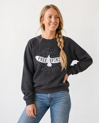 Woman wearing dark gray Free Spirit boho sweatshirt with jeans