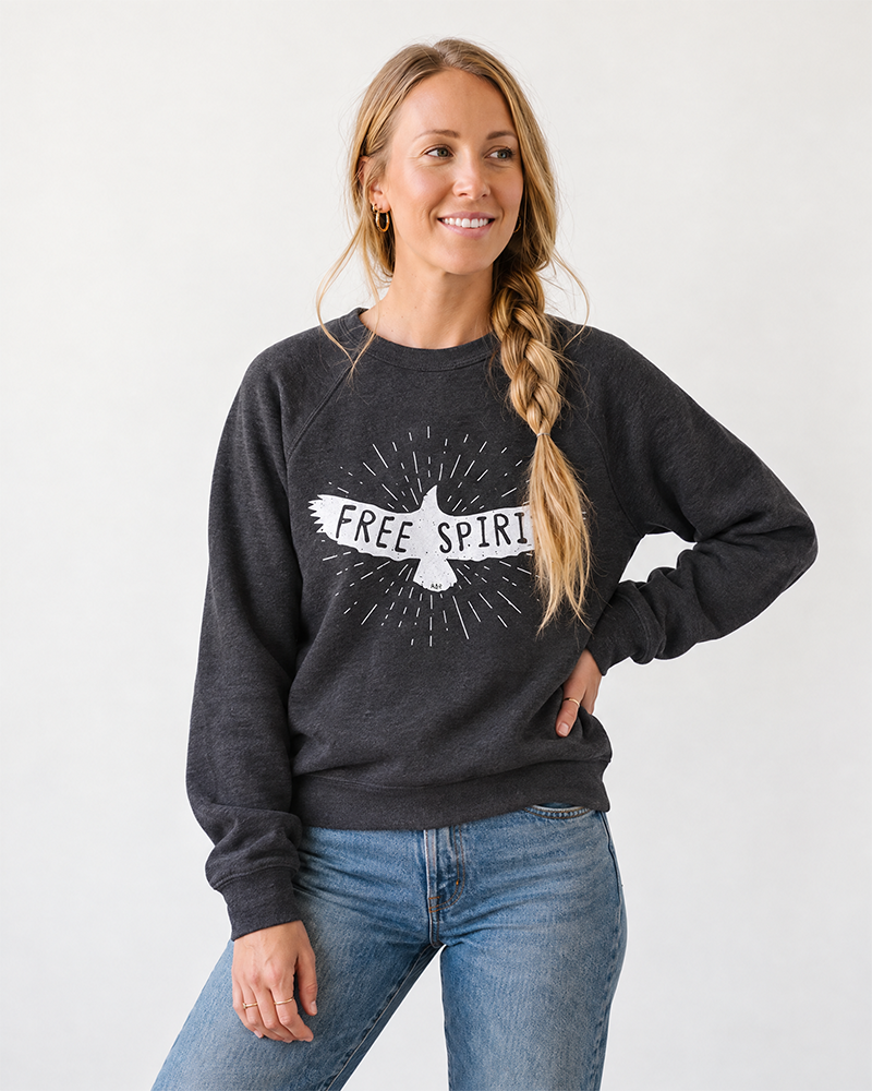 Woman wearing dark gray Free Spirit boho sweatshirt with jeans