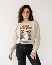 Woman wearing Freshly Boo’d Coffee sand Halloween ghost sweatshirt