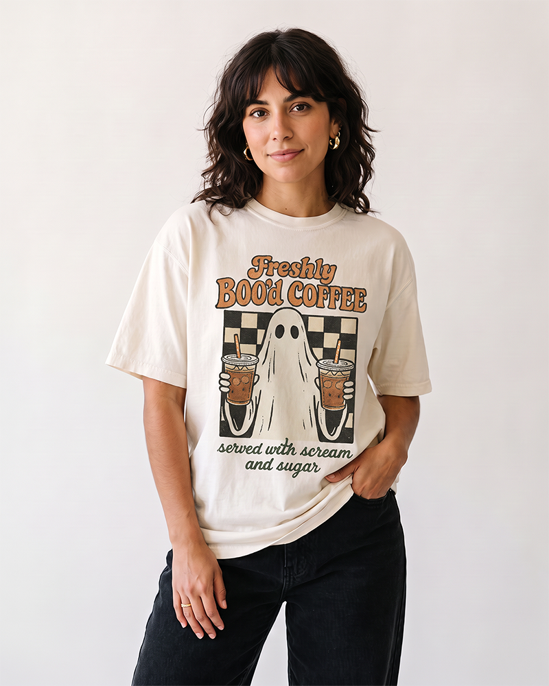 Woman wearing Freshly Boo’d Coffee ivory Halloween ghost graphic t-shirt