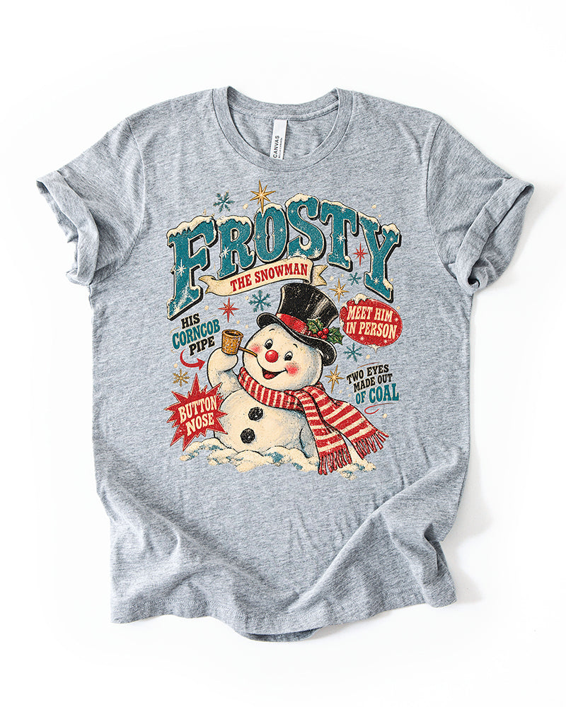 Athletic Heather lightweight Christmas graphic T-shirt featuring Frosty the Snowman, teal vintage lettering, red striped scarf, and retro holiday details.