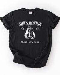 Black Comfort Colors heavyweight Girls Boxing t-shirt with white hanging boxing gloves, stars and Bronx New York lettering.