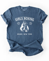 Denim blue Girls Boxing heavyweight graphic tee with distressed white boxing gloves and vintage Bronx New York lettering.