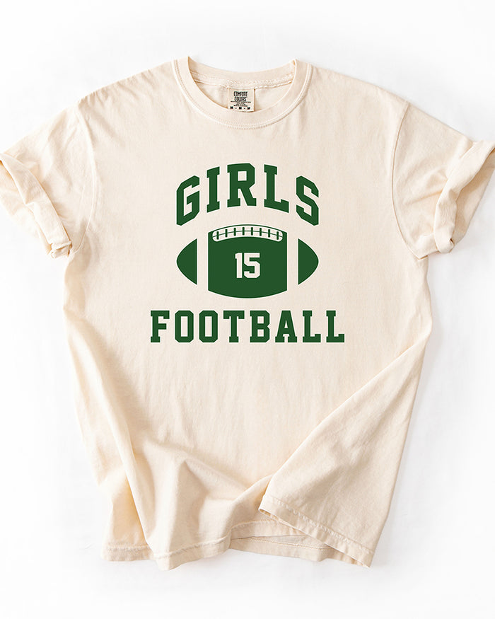Ivory Comfort Colors heavyweight graphic tee with forest green Girls Football lettering and number 15 football design.