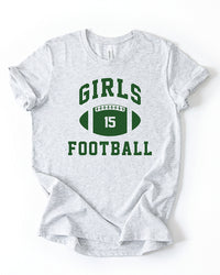 Ash grey lightweight Girls Football graphic tee featuring green varsity lettering and a football with number 15.