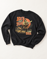 Black He's From Texas I Can Tell horror Western crewneck sweatshirt with retro chainsaw graphic