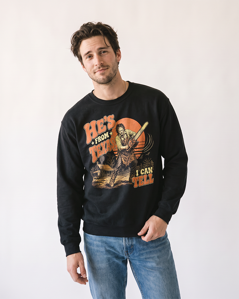 Man wearing black He's From Texas chainsaw horror Western sweatshirt