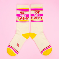 Hot And Flashy funny menopause socks with red lettering, pink stripes, and yellow heels and toes