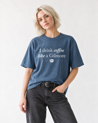 Woman wearing denim blue I Drink Coffee Like a Gilmore tee