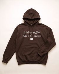 Dark chocolate I Drink Coffee Like a Gilmore hoodie featuring a Luke's Diner coffee cup graphic