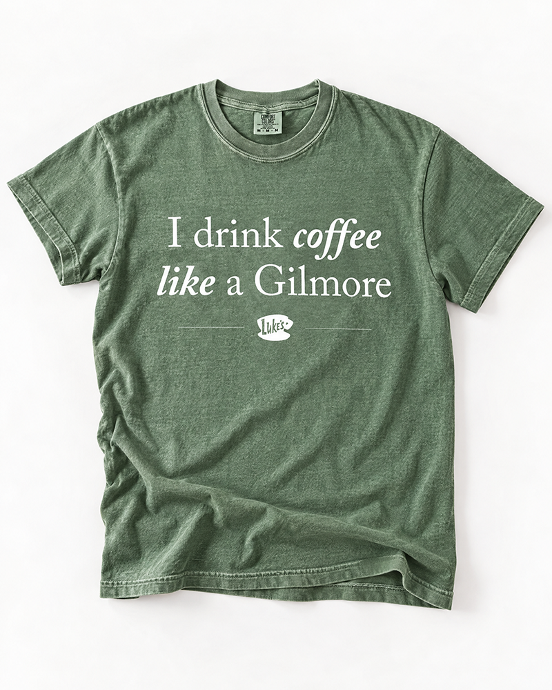 I Drink Coffee Like a Gilmore graphic tee in moss green