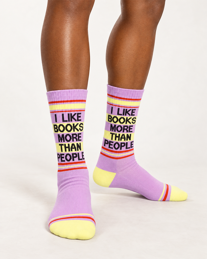 I Like Books More Than People gym socks worn by female model, featuring lilac purple knit, yellow toes and retro stripes