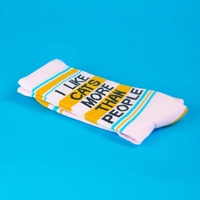 Folded I Like Cats More Than People socks showing black lettering, yellow bands and turquoise stripes