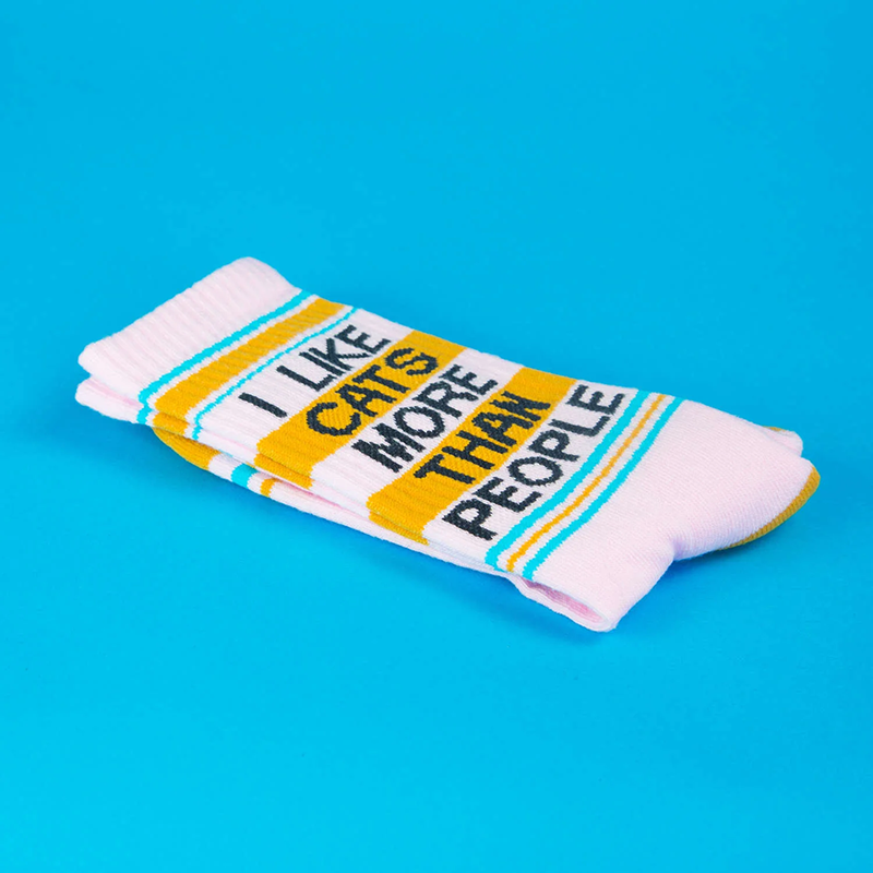 Folded I Like Cats More Than People socks showing black lettering, yellow bands and turquoise stripes