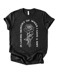 Black Heather In Loving Memory lightweight graphic tee with white skeleton hand holding a rose design