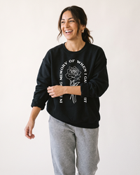 Woman wearing black In Loving Memory sarcastic graphic crewneck sweatshirt