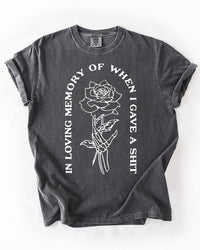 Pepper gray heavyweight graphic tee with white skeleton hand, rose and In Loving Memory quote design