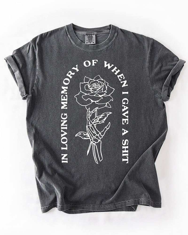 Pepper gray heavyweight graphic tee with white skeleton hand, rose and In Loving Memory quote design
