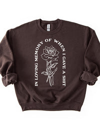Dark chocolate brown In Loving Memory crewneck sweatshirt with white skeleton hand and rose design