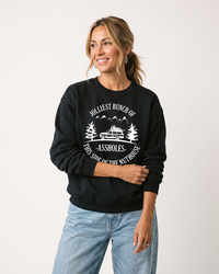 Woman modeling black Jolliest Bunch of Assholes funny holiday sweatshirt