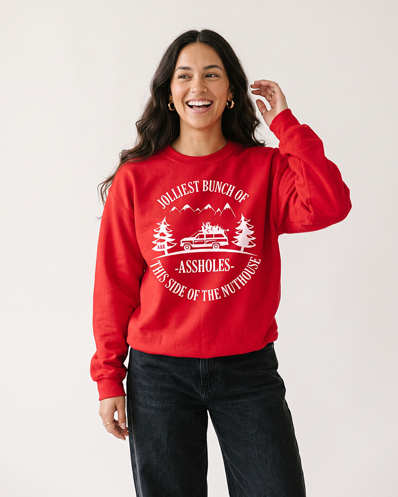 Woman modeling red Jolliest Bunch of Assholes funny Christmas sweatshirt