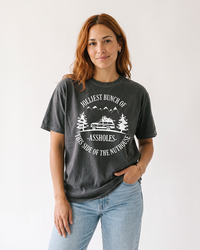 Woman wearing pepper Jolliest Bunch of Assholes funny holiday graphic tee