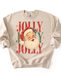 Sand colored Jolly Santa Christmas sweatshirt featuring a nostalgic winking Santa illustration, holly, and retro holiday typography.
