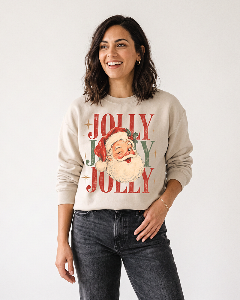 Woman wearing a sand vintage Jolly Santa Christmas crewneck sweatshirt with black jeans and a retro holiday graphic.
