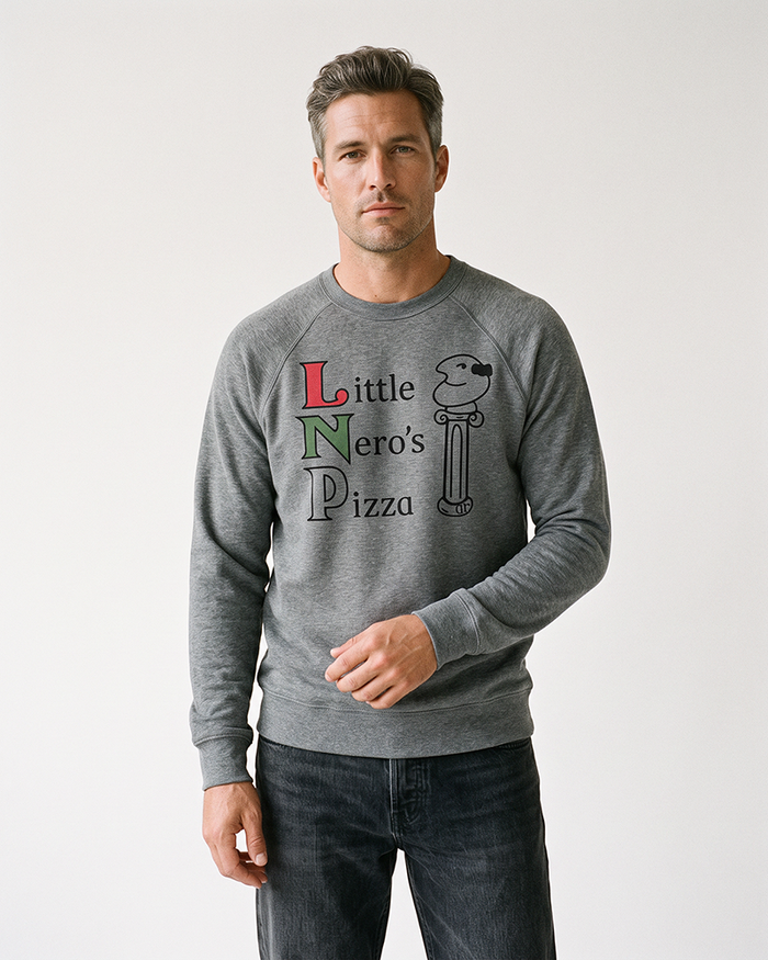 Man wearing a grey triblend Little Nero's Pizza raglan crewneck sweatshirt with black jeans