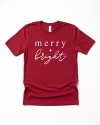 Cardinal red Merry + Bright Christmas graphic tee with white lettering