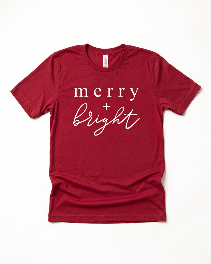 Cardinal red Merry + Bright Christmas graphic tee with white lettering