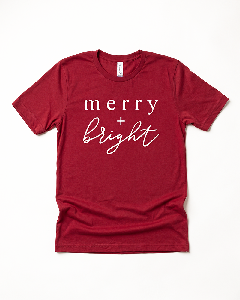 Cardinal red Merry + Bright Christmas graphic tee with white lettering