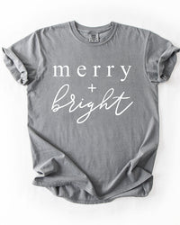 Grey Merry + Bright heavyweight holiday graphic tee with white lettering