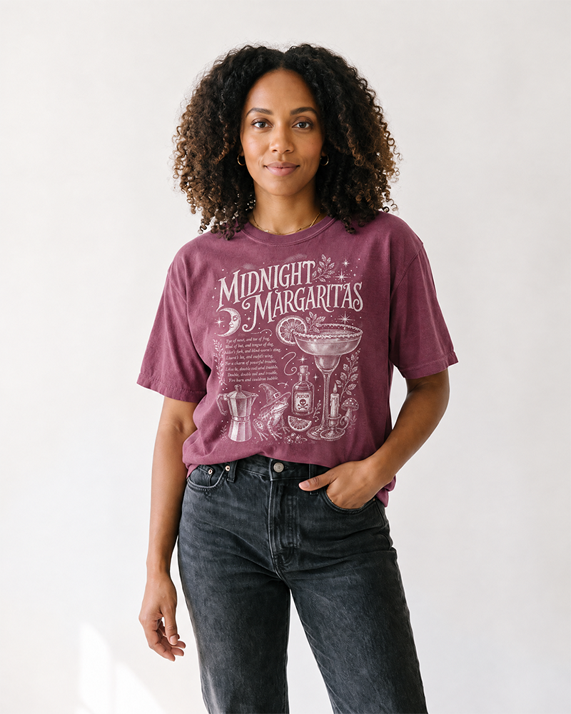 Woman wearing berry Midnight Margaritas witchy graphic t-shirt