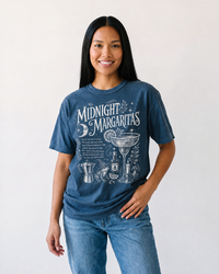 Woman wearing midnight blue Midnight Margaritas witchy graphic t-shirt