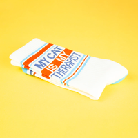Folded My Cat Is My Therapist cat lover socks featuring blue lettering and orange striped design
