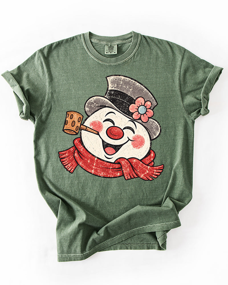 Moss green Comfort Colors heavyweight Christmas tee featuring an oversized distressed retro snowman with red scarf and top hat.
