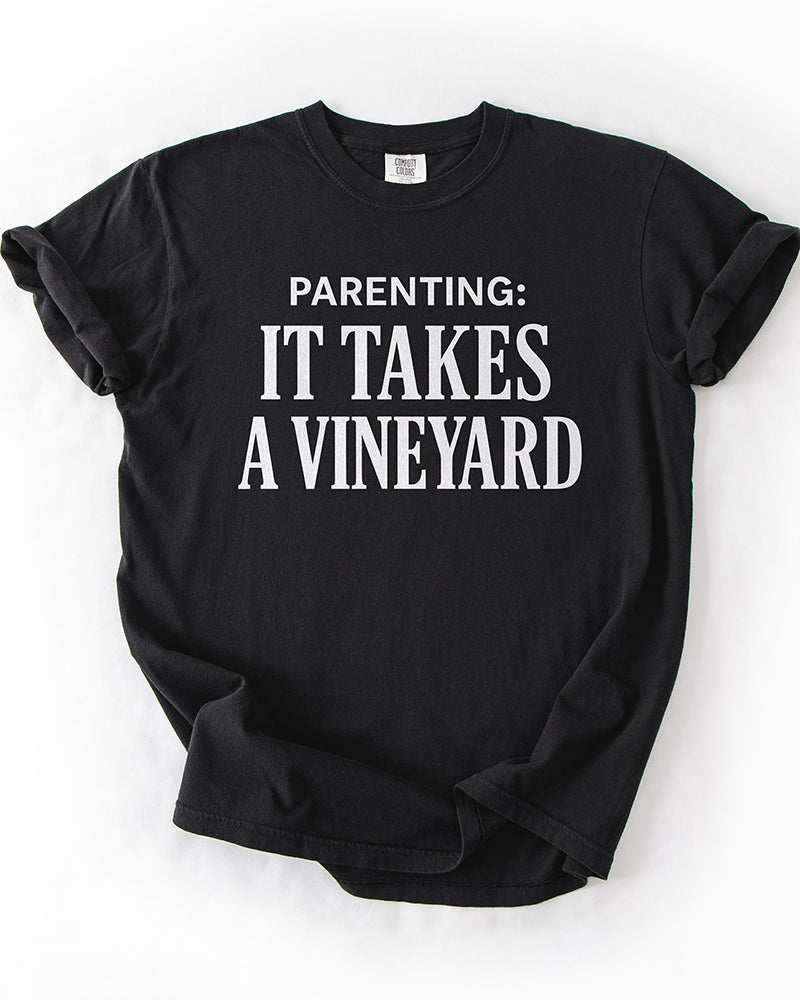 Parenting It Takes a Vineyard black funny parenting graphic tee