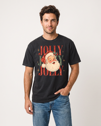 Man wearing a black Jolly Jolly Jolly vintage Santa heavyweight Christmas tee with relaxed unisex fit and blue jeans.
