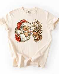 Ivory Comfort Colors heavyweight Christmas T-shirt with vintage Santa and red-nosed reindeer Boop illustration.