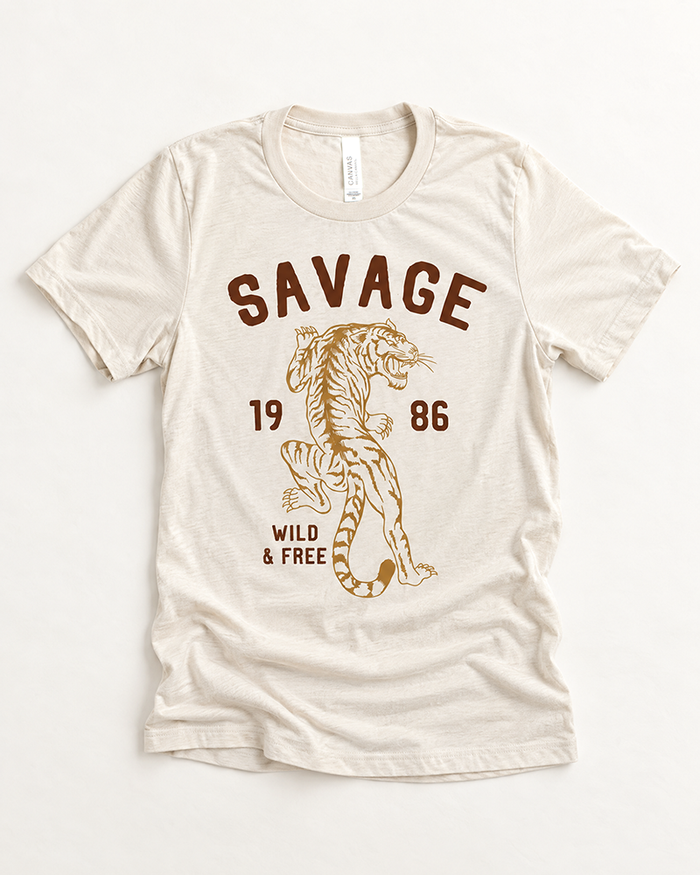 Savage Wild & Free tiger graphic tee in a warm neutral color with vintage-inspired brown and golden tiger artwork