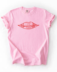 Blossom pink heavyweight cotton T-shirt featuring a red lips graphic with Save The Drama For Your Mama lettering.