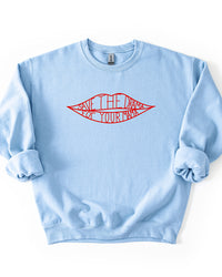 Light blue Save The Drama For Your Mama crewneck sweatshirt with bold red lips graphic and ribbed cuffs.