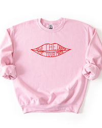 Light pink crewneck sweatshirt featuring the red Save The Drama For Your Mama lips graphic.